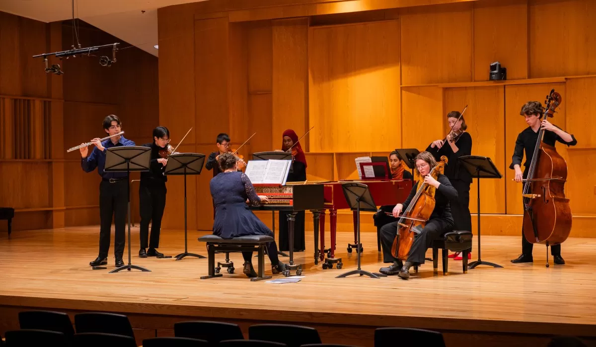 Ensemble of musicians performing onstage