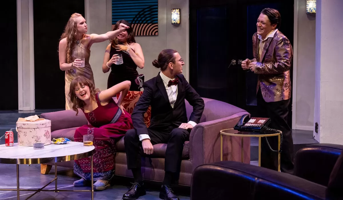 A group of men and women dressed in upscale vintage clothing.
