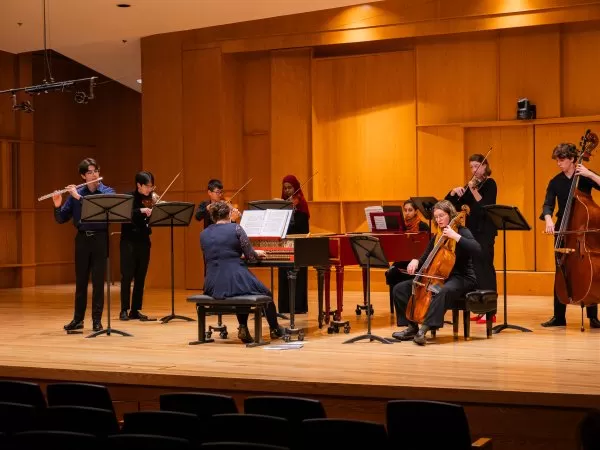 Ensemble of musicians performing onstage